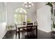 Bright dining area with dark wood flooring, ample natural light, and views of the outdoor pool at 2026 E Cortez Dr, Gilbert, AZ 85234