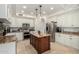 Well-equipped kitchen with stainless steel appliances, a center island, and custom cabinets at 2026 E Cortez Dr, Gilbert, AZ 85234