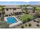 An aerial view of an estate showcasing a private pool, patio, lawn, and surrounding neighborhood at 22925 N 46Th St, Phoenix, AZ 85050