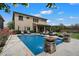A refreshing backyard oasis with a sparkling pool, water feature, and lounge chairs perfect for relaxation at 22925 N 46Th St, Phoenix, AZ 85050