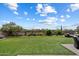 Lush backyard featuring a well-manicured lawn and desert landscaping, offering ample space at 22925 N 46Th St, Phoenix, AZ 85050