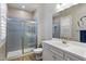 Bathroom featuring gray subway tile in the shower, white cabinets, and modern fixtures at 22925 N 46Th St, Phoenix, AZ 85050