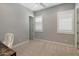 Neutral bedroom with carpet, white walls, shuttered windows, and a desk at 22925 N 46Th St, Phoenix, AZ 85050