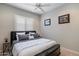 Neutral bedroom featuring a padded headboard, shuttered windows, and carpeted floors at 22925 N 46Th St, Phoenix, AZ 85050