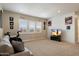 Large bonus room with carpet, shiplap wall, and a view of the outdoors at 22925 N 46Th St, Phoenix, AZ 85050