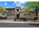 Charming two-story home with stone accents, covered porch, and meticulously landscaped front yard at 22925 N 46Th St, Phoenix, AZ 85050