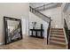 Grand foyer with staircase, wood floors, dark wood accents, and high ceilings, creating a welcoming space at 22925 N 46Th St, Phoenix, AZ 85050