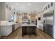 Open kitchen featuring white cabinets, stainless steel appliances, an island, and under cabinet lighting at 22925 N 46Th St, Phoenix, AZ 85050