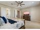 Well-lit primary bedroom with ceiling fan, private en-suite bath, and walk-in closet at 22925 N 46Th St, Phoenix, AZ 85050