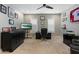 Spacious office with neutral walls, built-in desk, ceiling fan, and carpet flooring at 22925 N 46Th St, Phoenix, AZ 85050