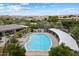 Community pool with lounge chairs and shaded area, nestled in lush landscaping at 22925 N 46Th St, Phoenix, AZ 85050