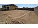 New home under construction, features an expansive backyard with potential for landscaping and outdoor living space at 2300 E Spur Dr, San Tan Valley, AZ 85140