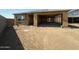 New home under construction, showcasing a spacious layout with attached garage and a large, open yard at 2300 E Spur Dr, San Tan Valley, AZ 85140
