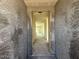 Hallway of a new construction home featuring textured walls and concrete flooring at 2300 E Spur Dr, San Tan Valley, AZ 85140