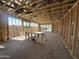 Spacious interior under construction, featuring a modern open-concept design with exposed beams and ample natural light at 2300 E Spur Dr, San Tan Valley, AZ 85140