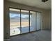 Living room with large sliding glass doors leads to backyard, great natural light at 2300 E Spur Dr, San Tan Valley, AZ 85140