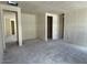 New construction living room featuring drywall walls, concrete flooring, and access to the hallway at 2300 E Spur Dr, San Tan Valley, AZ 85140