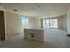 New construction living room featuring drywall walls, concrete flooring, and access to the backyard at 2300 E Spur Dr, San Tan Valley, AZ 85140