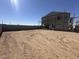 New construction home with dirt backyard and cinder block fencing at 2325 E Homesteader Rd, San Tan Valley, AZ 85140