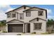 Charming two-story home featuring neutral stucco, a two-car garage, and well-placed windows allowing for natural light at 2325 E Homesteader Rd, San Tan Valley, AZ 85140