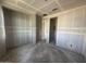 Hallway with unfinished walls and ceilings, highlighting the layout and flow of the home's interior spaces at 2325 E Homesteader Rd, San Tan Valley, AZ 85140