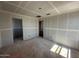 Unfinished living room featuring bare floors, drywall, and doorway openings to other rooms at 2325 E Homesteader Rd, San Tan Valley, AZ 85140