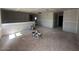 Large open-concept living area with unfinished floors, offering potential for customization and seamless transitions between spaces at 2325 E Homesteader Rd, San Tan Valley, AZ 85140