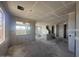Open-concept unfinished living room, featuring large windows and a potential breakfast bar, ideal for modern living at 2325 E Homesteader Rd, San Tan Valley, AZ 85140
