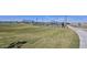 Community park with grass, walking path, and a covered picnic area near pickleball courts at 2382 E Homesteader Rd, San Tan Valley, AZ 85140