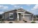 Charming single-story home featuring a neutral-toned exterior, covered entryway, and attached two-car garage at 2382 E Homesteader Rd, San Tan Valley, AZ 85140