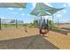 Community playground with swings, slides, and covered seating area at 2382 E Homesteader Rd, San Tan Valley, AZ 85140
