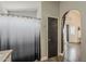 A calming bathroom with a shower featuring a stylish ombre curtain and seamless access to the rest of the house at 2579 E Camellia Dr, Gilbert, AZ 85296