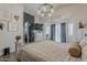 Bedroom featuring wood floors, a canopy bed, and a mounted TV at 2579 E Camellia Dr, Gilbert, AZ 85296