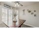 Bright dining space with a rustic table, shuttered windows, and decorative accents at 2579 E Camellia Dr, Gilbert, AZ 85296
