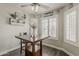 Inviting dining area with natural light from shuttered windows and a ceiling fan at 2579 E Camellia Dr, Gilbert, AZ 85296
