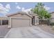 Charming single-story home featuring a two-car garage, desert landscaping, and a welcoming front entrance at 2579 E Camellia Dr, Gilbert, AZ 85296