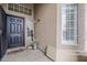 Welcoming front porch featuring a black front door, decorative accents, and ample natural light at 2579 E Camellia Dr, Gilbert, AZ 85296