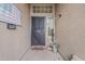 Welcoming front porch featuring a black security door, decorative accents, and ample natural light at 2579 E Camellia Dr, Gilbert, AZ 85296