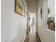 Hallway with wood floors and decorative wall cut-outs at 2579 E Camellia Dr, Gilbert, AZ 85296