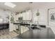 Modern kitchen featuring black countertops, white cabinets, and stainless steel appliances at 2579 E Camellia Dr, Gilbert, AZ 85296