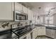 Well-equipped kitchen with stainless steel appliances and ample counter space at 2579 E Camellia Dr, Gilbert, AZ 85296