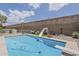 Backyard pool with a white slide and diving board at 2579 E Camellia Dr, Gilbert, AZ 85296