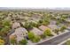 Aerial view of a peaceful neighborhood, showcasing manicured lawns, mature trees, and beautiful homes in a serene setting at 2610 E Leiber Ln, Phoenix, AZ 85024