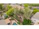 Aerial view featuring a private backyard with a sparkling swimming pool, landscaped patio, and cozy outdoor furniture at 2610 E Leiber Ln, Phoenix, AZ 85024