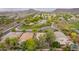 Aerial view of the neighborhood showcasing a community park with green space, mature trees, and walking paths at 2610 E Leiber Ln, Phoenix, AZ 85024