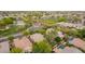 Expansive aerial view of the neighborhood, showcasing mature trees and community green spaces and amenities at 2610 E Leiber Ln, Phoenix, AZ 85024