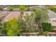 Backyard aerial view showcasing a private swimming pool, mature trees, and a patio area for outdoor relaxation at 2610 E Leiber Ln, Phoenix, AZ 85024