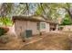 Backyard featuring a covered patio, landscaped perimeter, and exterior of the home at 2610 E Leiber Ln, Phoenix, AZ 85024