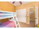 Playful bedroom showcasing a bunk bed and a closet for storage at 2610 E Leiber Ln, Phoenix, AZ 85024