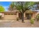 Charming single-story home with a well-manicured front yard and a two-car garage at 2610 E Leiber Ln, Phoenix, AZ 85024